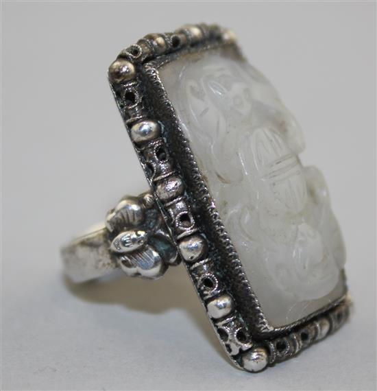 A Chinese silver mounted white jade ring, early 20th century, total width 3.1cm